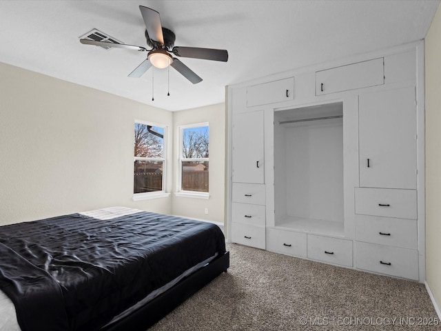 bedroom with visible vents, a ceiling fan, and carpet