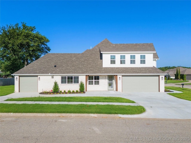 view of front facade featuring a front lawn and a garage