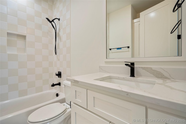 full bathroom featuring toilet, tiled shower / bath combo, and vanity