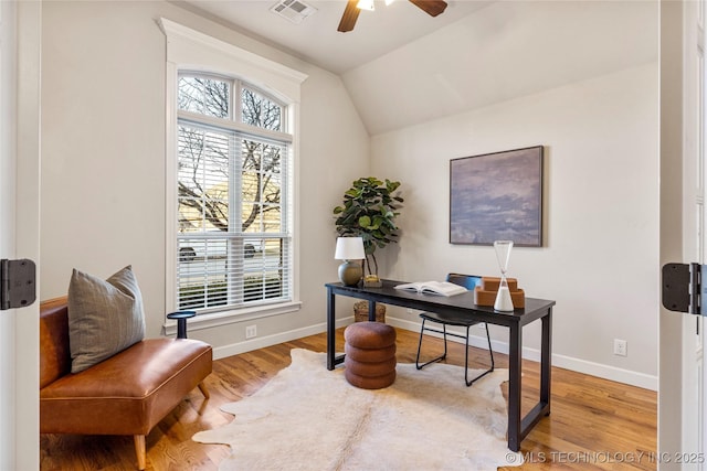 home office featuring lofted ceiling, ceiling fan, and light hardwood / wood-style floors