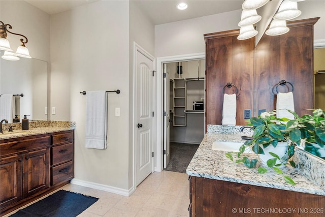 bathroom featuring vanity and an inviting chandelier