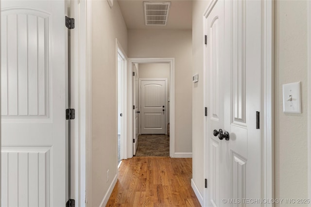 hallway featuring light hardwood / wood-style flooring