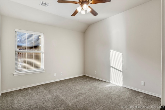 carpeted empty room featuring ceiling fan and lofted ceiling