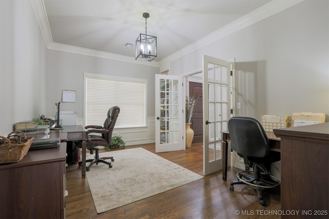 office featuring dark hardwood / wood-style flooring, ornamental molding, french doors, and a notable chandelier