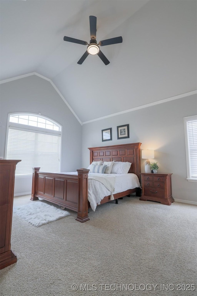 bedroom with vaulted ceiling, ceiling fan, and carpet