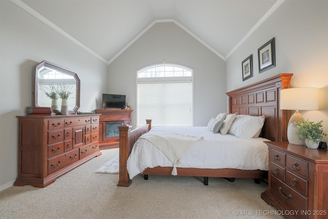 carpeted bedroom with crown molding and vaulted ceiling