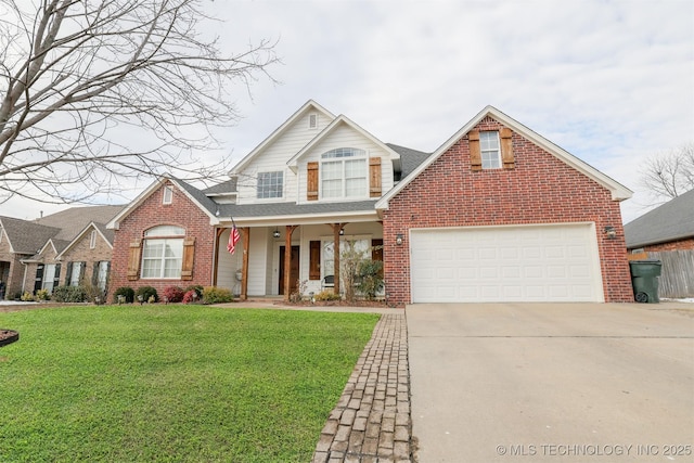 view of property featuring a front yard, a garage, and a porch