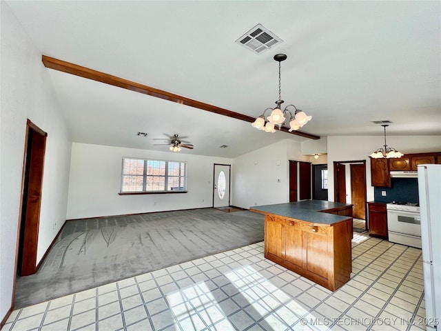 kitchen featuring white appliances, a kitchen bar, backsplash, ceiling fan with notable chandelier, and light carpet