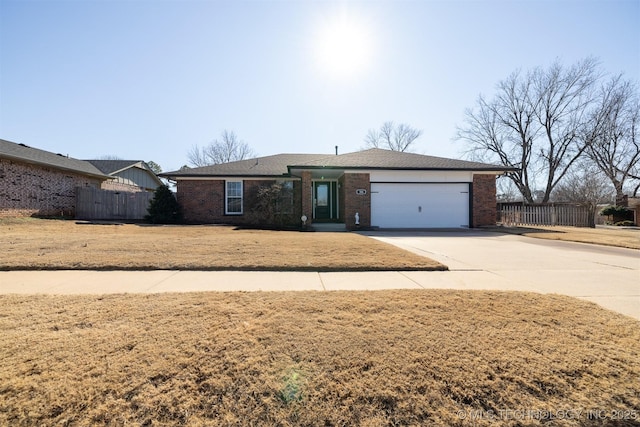 ranch-style home featuring a front yard and a garage