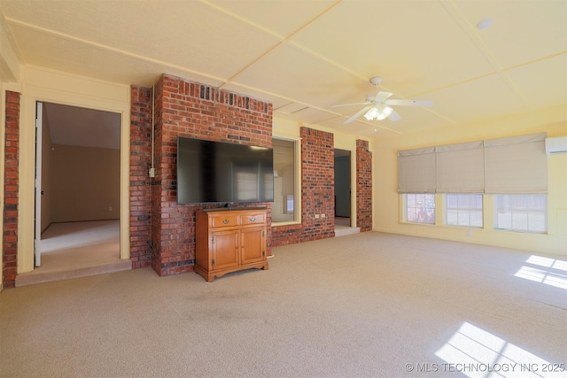 unfurnished living room featuring ceiling fan, carpet floors, and a wall unit AC