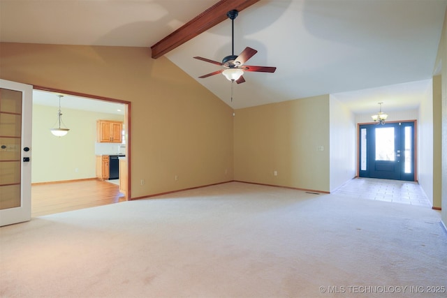 unfurnished living room featuring light colored carpet, beam ceiling, high vaulted ceiling, and ceiling fan with notable chandelier