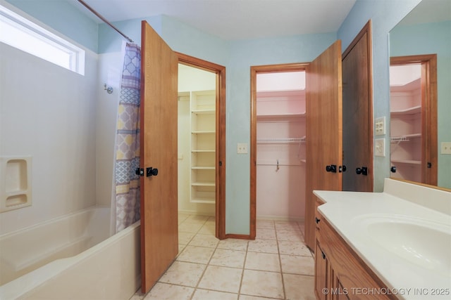 bathroom with tile patterned flooring, shower / bath combination with curtain, and vanity