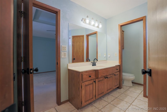 bathroom with toilet and vanity