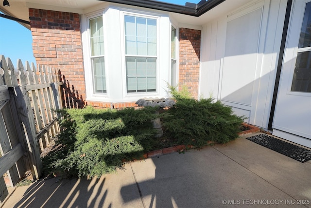 view of exterior entry featuring a patio