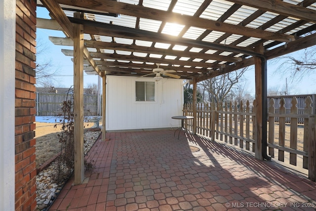 view of patio with ceiling fan and a pergola