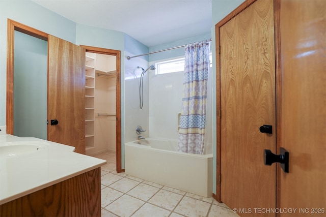 bathroom with tile patterned flooring, shower / bath combination with curtain, and vanity