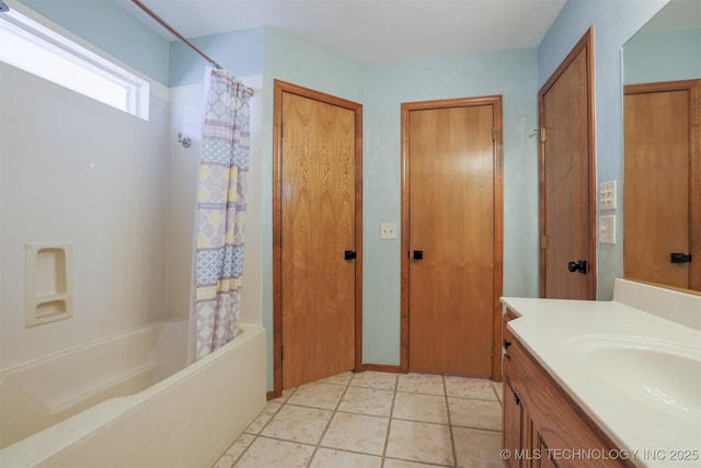 bathroom featuring vanity, tile patterned flooring, and shower / bath combo with shower curtain