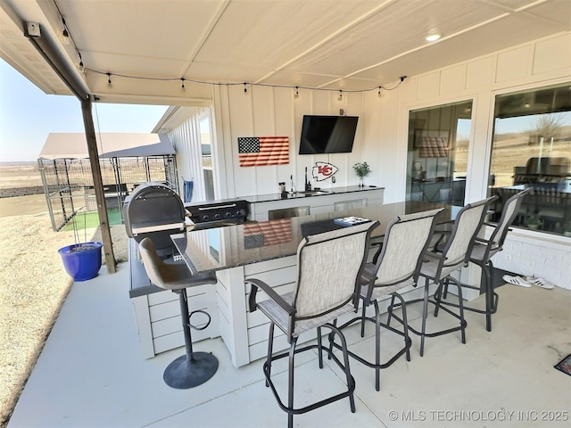 view of patio / terrace with an outdoor wet bar