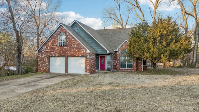 view of front of house with a front yard and a garage