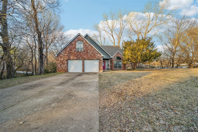 view of front of house with a front lawn and a garage