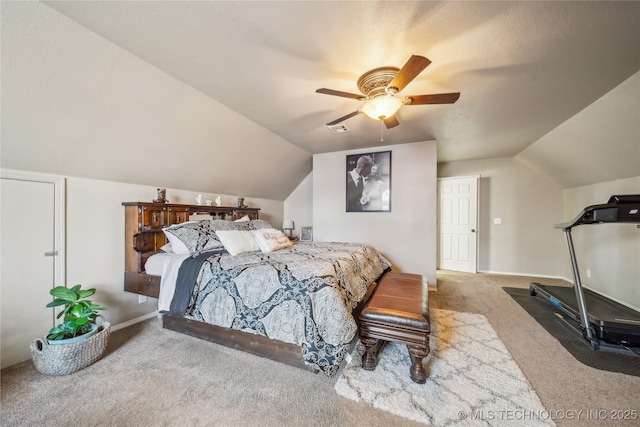 carpeted bedroom featuring lofted ceiling and ceiling fan