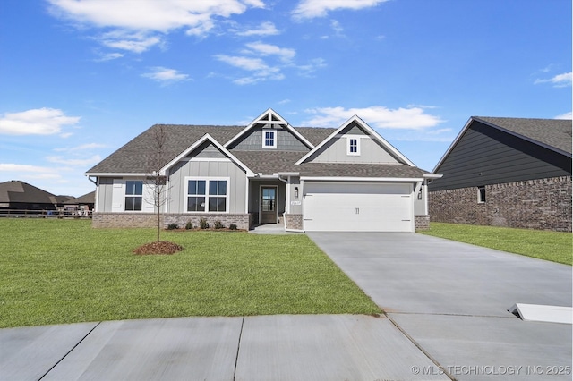 craftsman-style house featuring a garage and a front yard