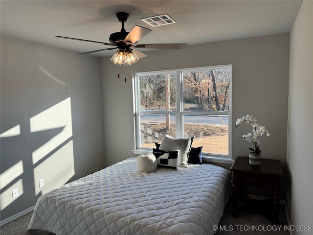 carpeted bedroom with ceiling fan