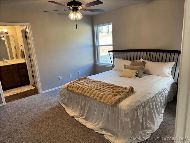 carpeted bedroom with ceiling fan, connected bathroom, and sink