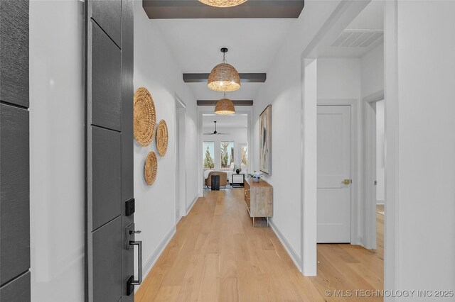 hall with light hardwood / wood-style floors