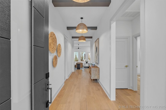 corridor with light wood-type flooring