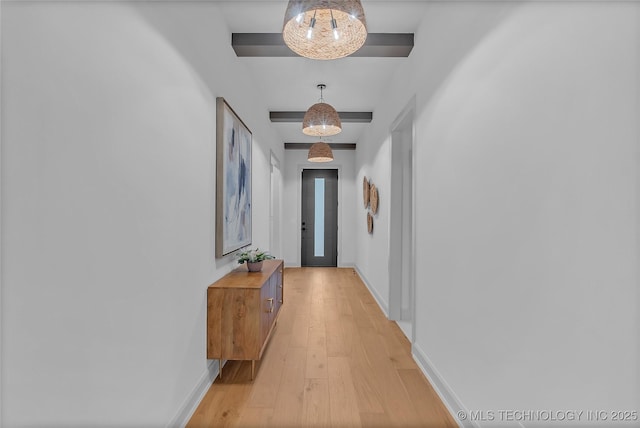 hallway with beamed ceiling and light wood-type flooring