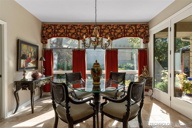 dining space featuring an inviting chandelier and a wealth of natural light