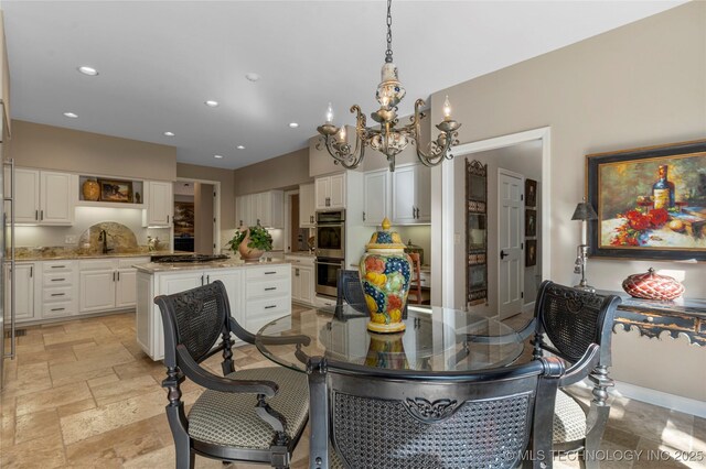 dining space with a chandelier