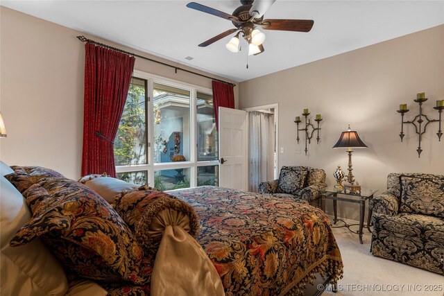 carpeted bedroom with ceiling fan