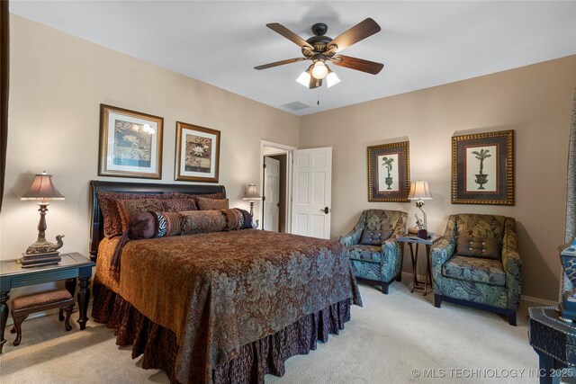 bedroom featuring light colored carpet and ceiling fan