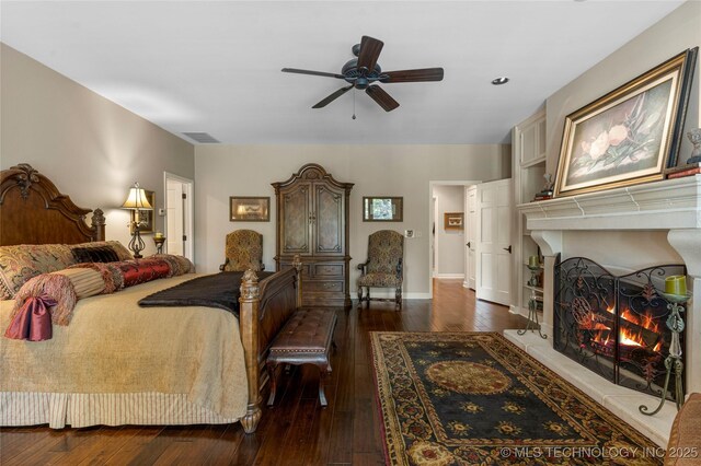 bedroom featuring dark wood-type flooring and ceiling fan