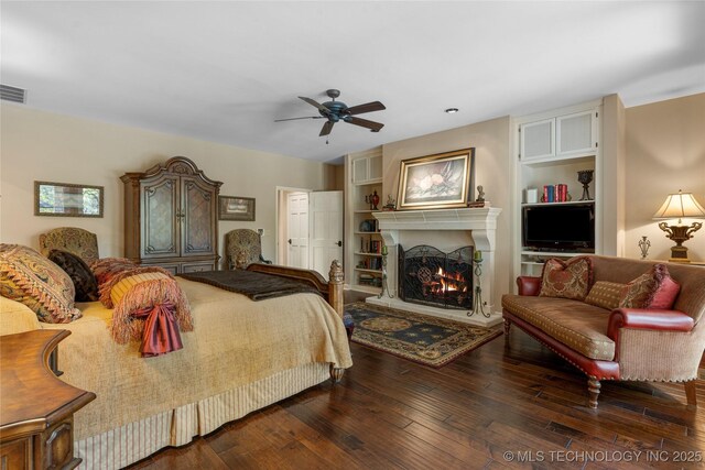 bedroom featuring ceiling fan and dark wood-type flooring