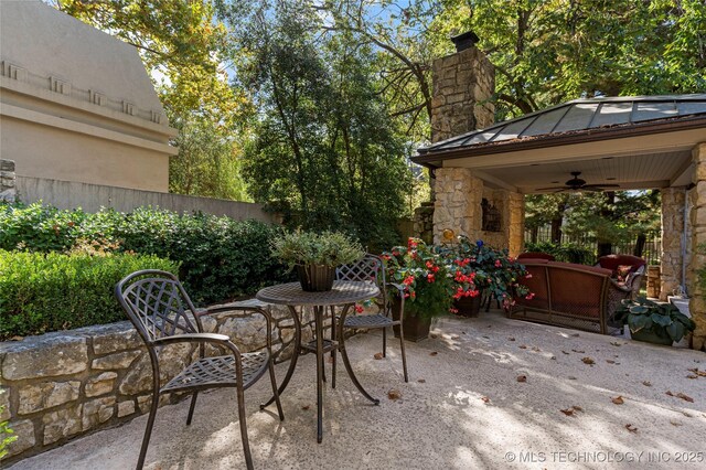 view of patio featuring an outdoor hangout area and ceiling fan