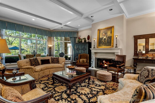 living room featuring beamed ceiling, hardwood / wood-style flooring, crown molding, and coffered ceiling