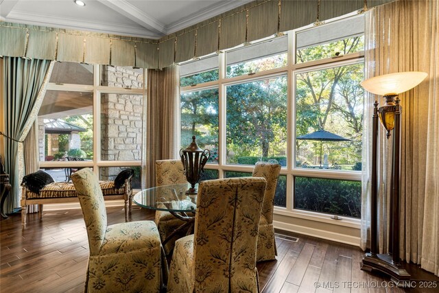 sunroom featuring vaulted ceiling