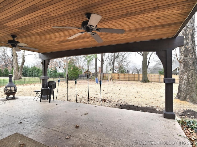 view of patio / terrace with ceiling fan and a playground