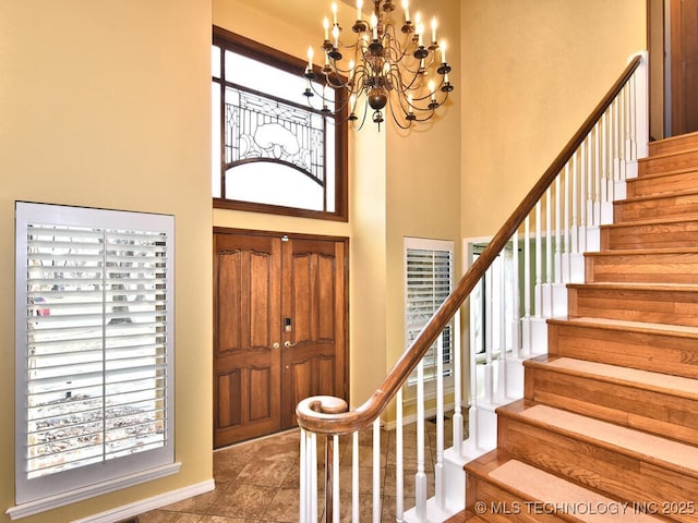 entrance foyer with a high ceiling and an inviting chandelier