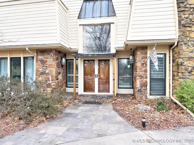 property entrance featuring french doors