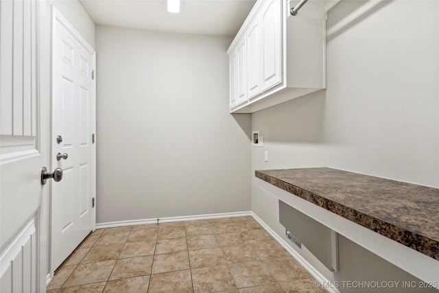 laundry room featuring hookup for a washing machine and cabinets