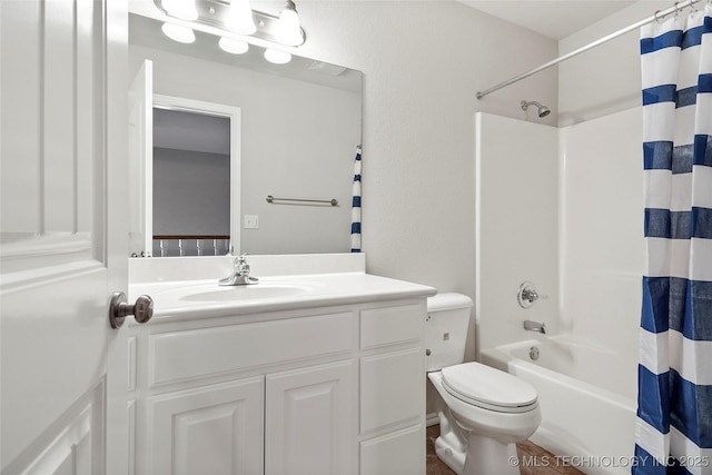 full bathroom featuring toilet, vanity, and shower / bath combo