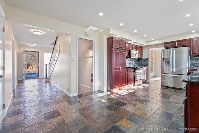 kitchen with backsplash and appliances with stainless steel finishes