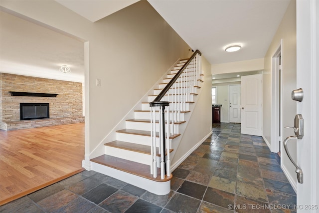 stairway with a fireplace