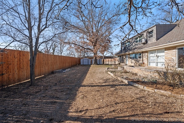 view of yard featuring a patio area and a shed