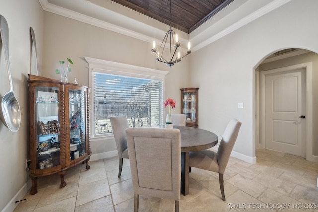 dining room with a notable chandelier and crown molding