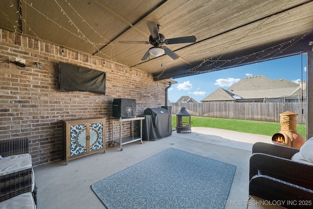 view of patio / terrace with ceiling fan and area for grilling